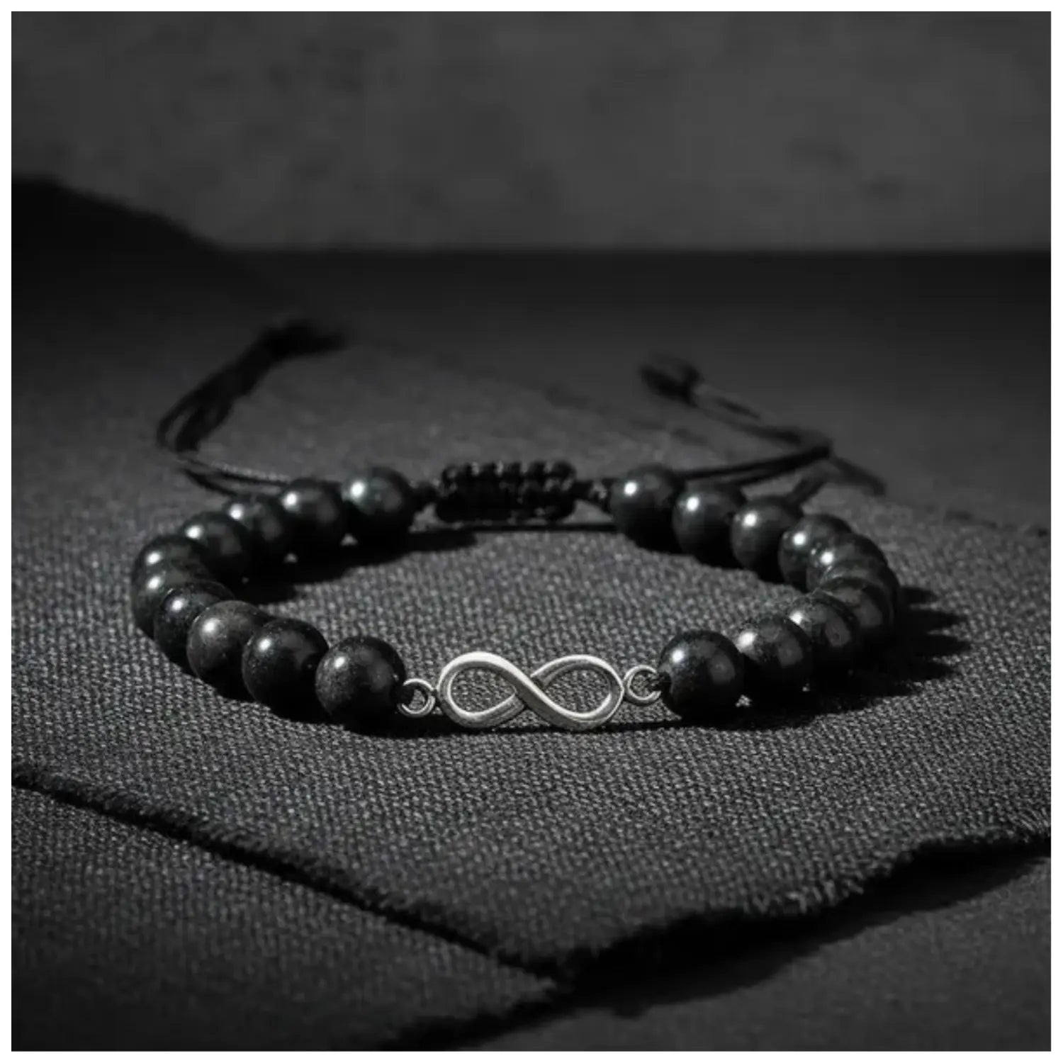 Pulsera Artesanal Piedra Natural Shungita con Dije Infinito de Plata - Bisutería Lola D